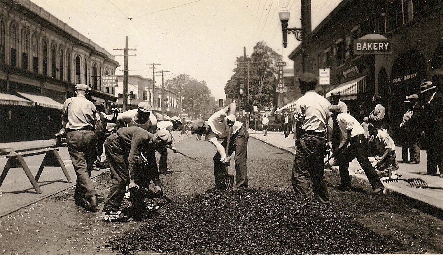 historical photo of McCourt workers laying asphalt