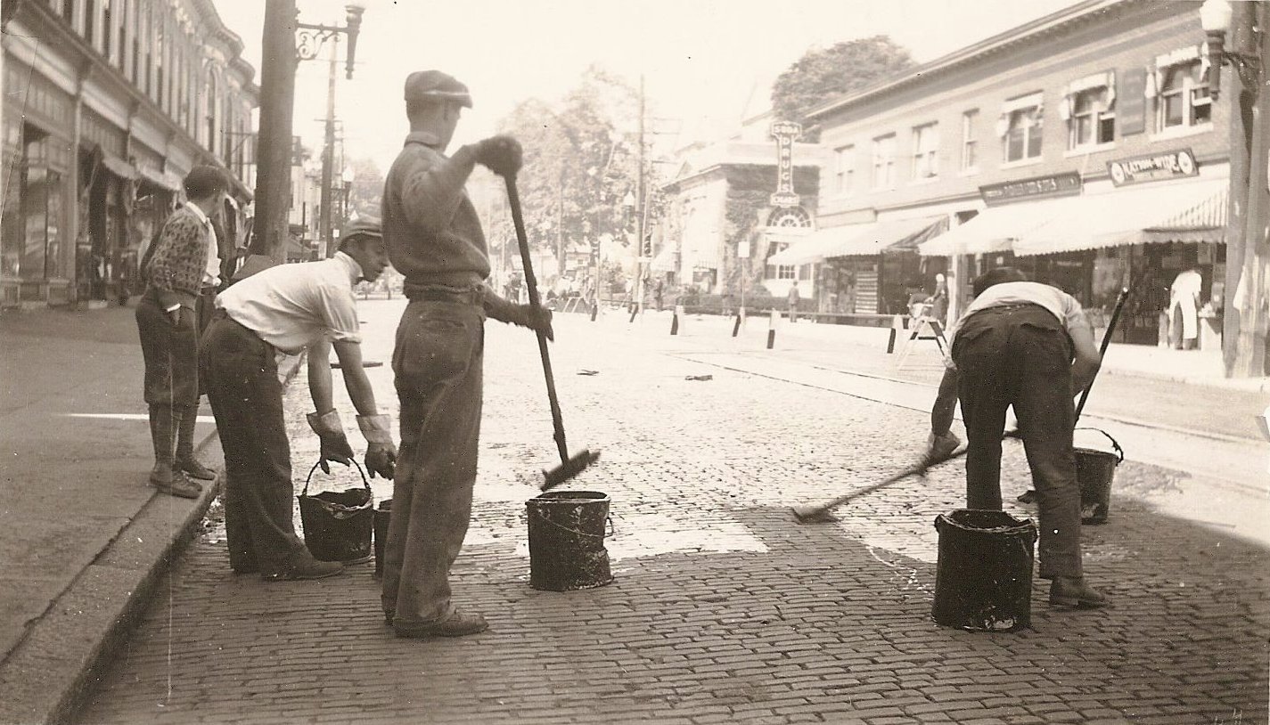 historical photo of McCourt workers laying asphalt